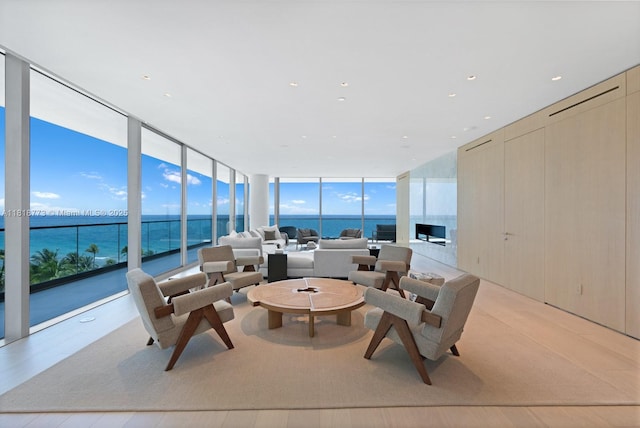 10203 Collins Ave Unit 701, Bal Harbour, FL 33154 - living area featuring a wall of windows and a water view