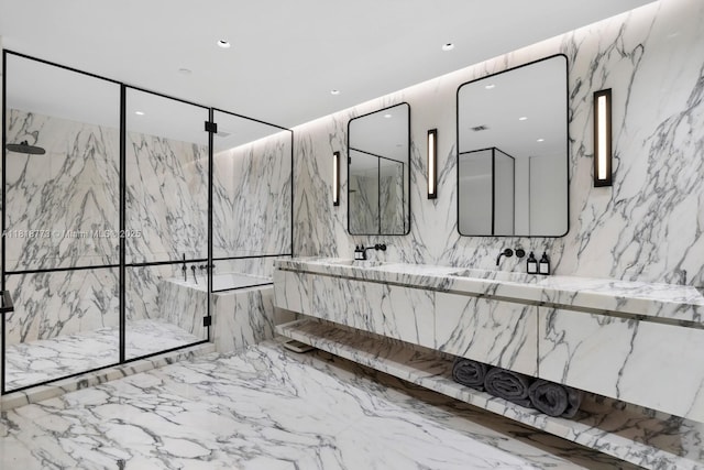 10203 Collins Ave Unit 701, Bal Harbour, FL 33154 - bathroom featuring a marble finish shower, double vanity, marble tiled flooring, recessed lighting, and stone wall