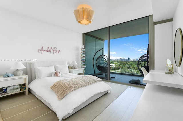 10203 Collins Ave Unit 701, Bal Harbour, FL 33154 - bedroom featuring expansive windows and access to exterior