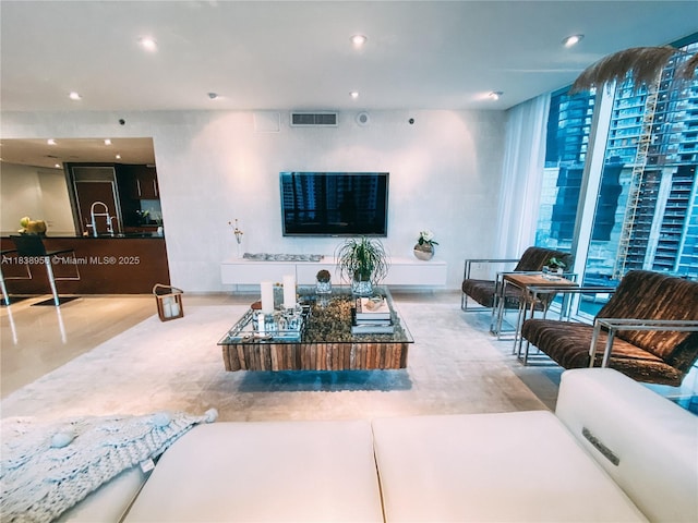 465 Brickell Ave Unit 1101, Miami, FL 33131 - living area with a wall of windows and recessed lighting