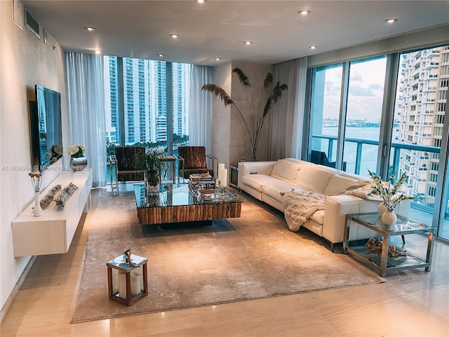 465 Brickell Ave Unit 1101, Miami, FL 33131 - living area featuring wood finished floors, recessed lighting, and floor to ceiling windows