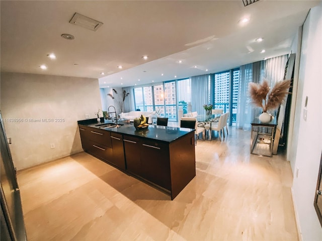 465 Brickell Ave Unit 1101, Miami, FL 33131 - kitchen with modern cabinets, dark countertops, recessed lighting, expansive windows, and a peninsula