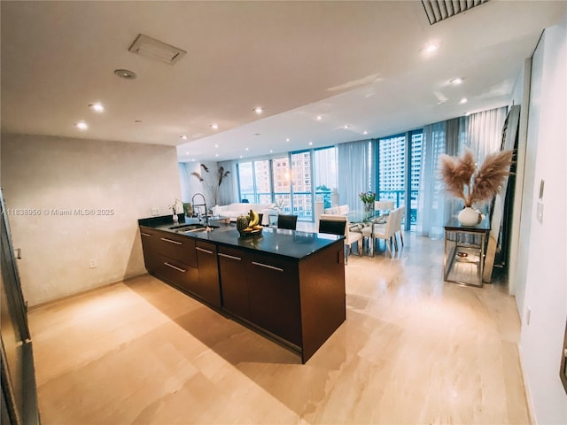 465 Brickell Ave Unit 1101, Miami, FL 33131 - kitchen with dark countertops, modern cabinets, recessed lighting, expansive windows, and a peninsula