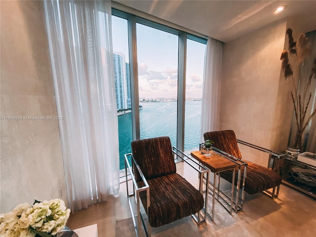465 Brickell Ave Unit 1101, Miami, FL 33131 - sitting room featuring a water view and expansive windows