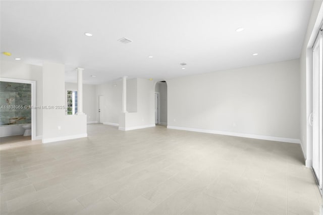 3451 SW 19th St, Fort Lauderdale, FL 33312 - unfurnished living room featuring recessed lighting, arched walkways, and decorative columns