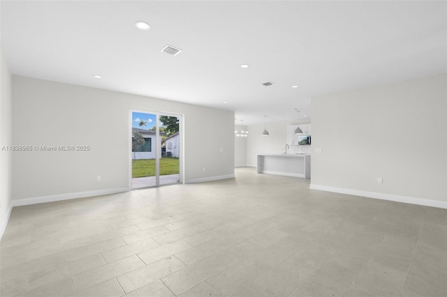 3451 SW 19th St, Fort Lauderdale, FL 33312 - unfurnished living room with recessed lighting and a chandelier