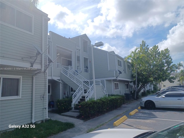 3421 NW 44th St Unit 103, Oakland Park, FL 33309 - view of property with uncovered parking and stairway