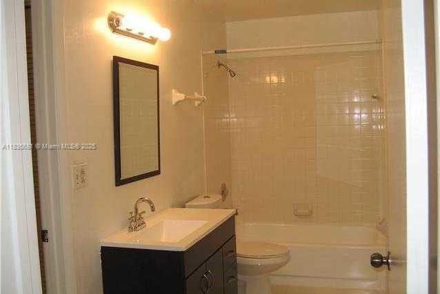 3421 NW 44th St Unit 103, Oakland Park, FL 33309 - bathroom with vanity and shower / bath combination