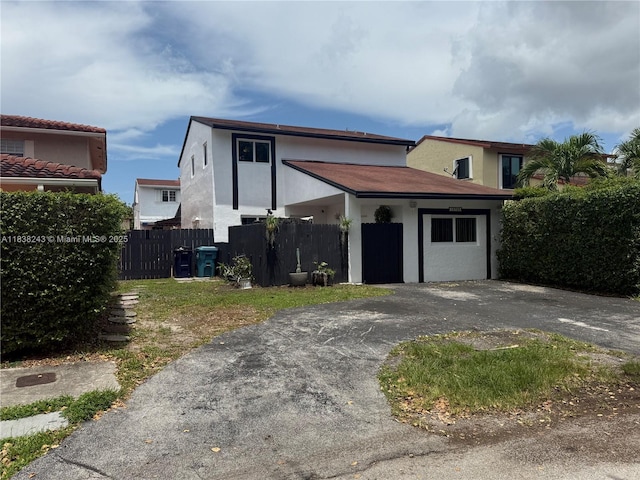 10726 SW 147th Pl, Miami, FL 33196 - view of front of home with asphalt driveway and stucco siding
