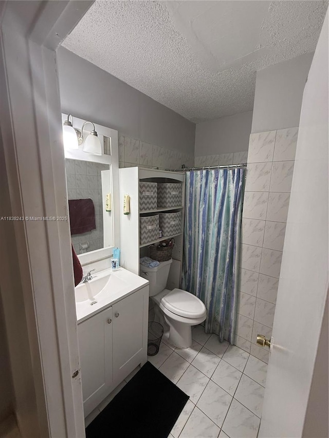 10726 SW 147th Pl, Miami, FL 33196 - bathroom with a textured ceiling, vanity, and curtained shower