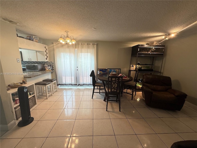 10726 SW 147th Pl, Miami, FL 33196 - dining room with a chandelier, light tile patterned floors, and a textured ceiling