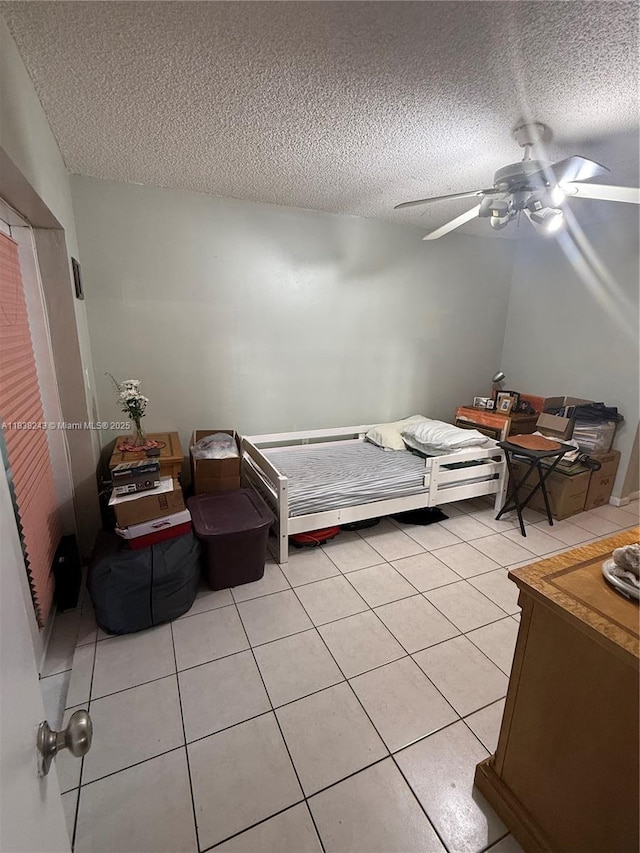10726 SW 147th Pl, Miami, FL 33196 - bedroom with a textured ceiling, a ceiling fan, and light tile patterned floors