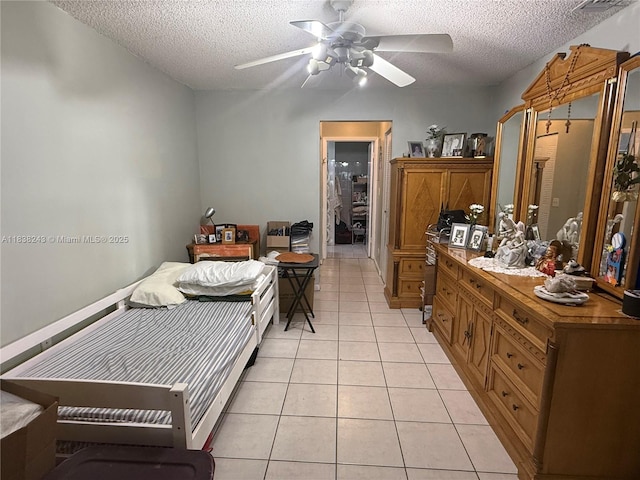 10726 SW 147th Pl, Miami, FL 33196 - bedroom featuring a textured ceiling, light tile patterned flooring, and a ceiling fan