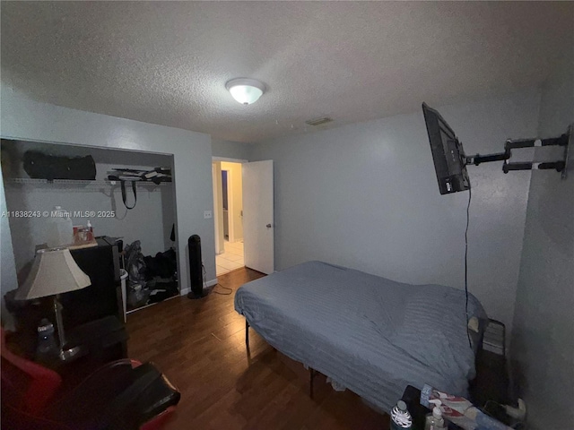 10726 SW 147th Pl, Miami, FL 33196 - bedroom with wood finished floors and a textured ceiling