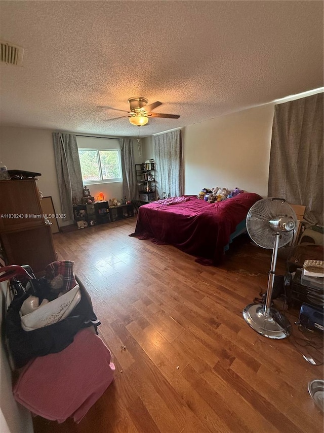 10726 SW 147th Pl, Miami, FL 33196 - bedroom featuring wood finished floors, a textured ceiling, and ceiling fan