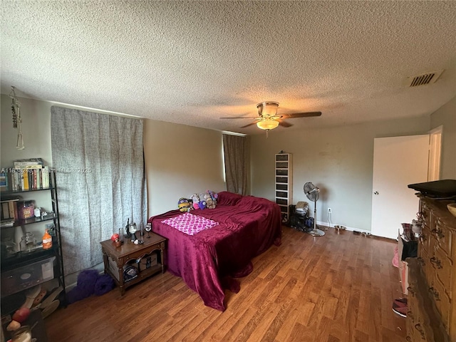 10726 SW 147th Pl, Miami, FL 33196 - bedroom with wood finished floors, a textured ceiling, and a ceiling fan
