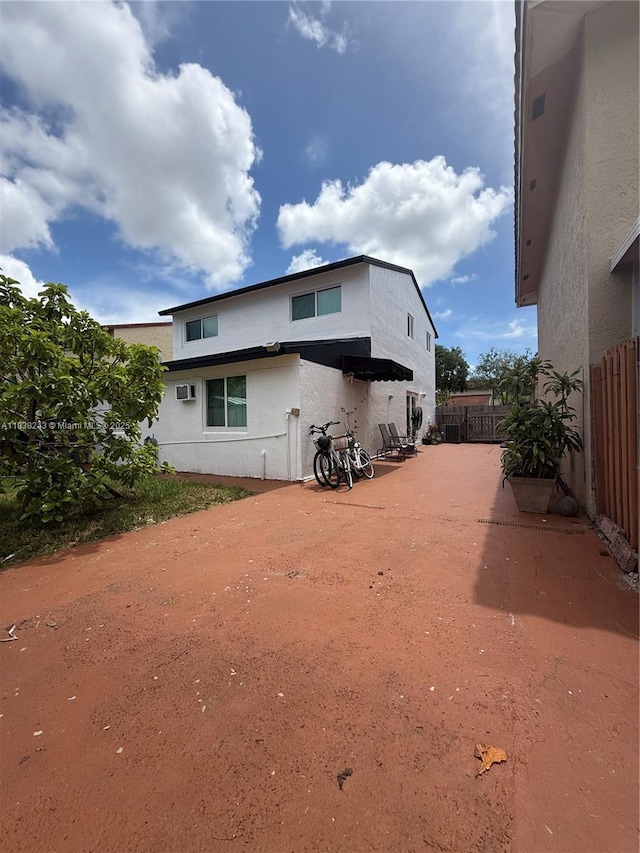 10726 SW 147th Pl, Miami, FL 33196 - back of house featuring stucco siding