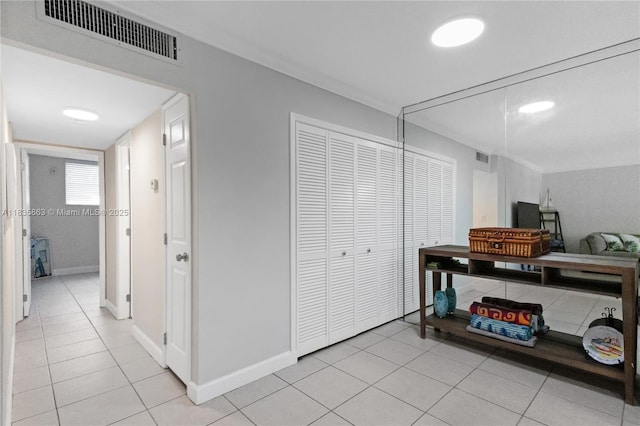 2400 NE 10th St Unit 104, Pompano Beach, FL 33062 - hall with light tile patterned floors and baseboards