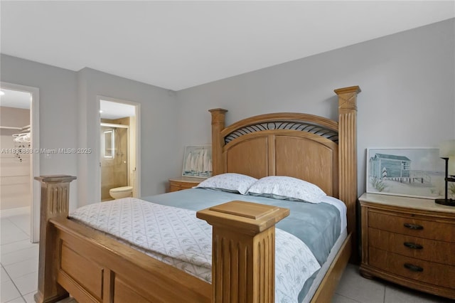 2400 NE 10th St Unit 104, Pompano Beach, FL 33062 - bedroom with light tile patterned floors and ensuite bath