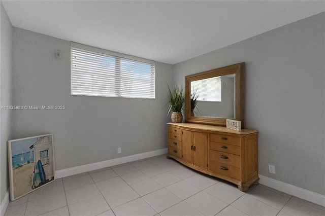 2400 NE 10th St Unit 104, Pompano Beach, FL 33062 - bedroom featuring light tile patterned floors