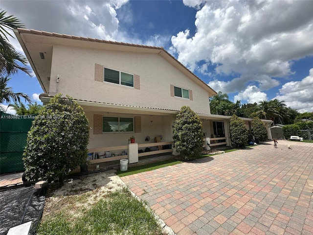 1249 S Flamingo Rd, Davie, FL 33325 - back of house featuring stucco siding and a patio
