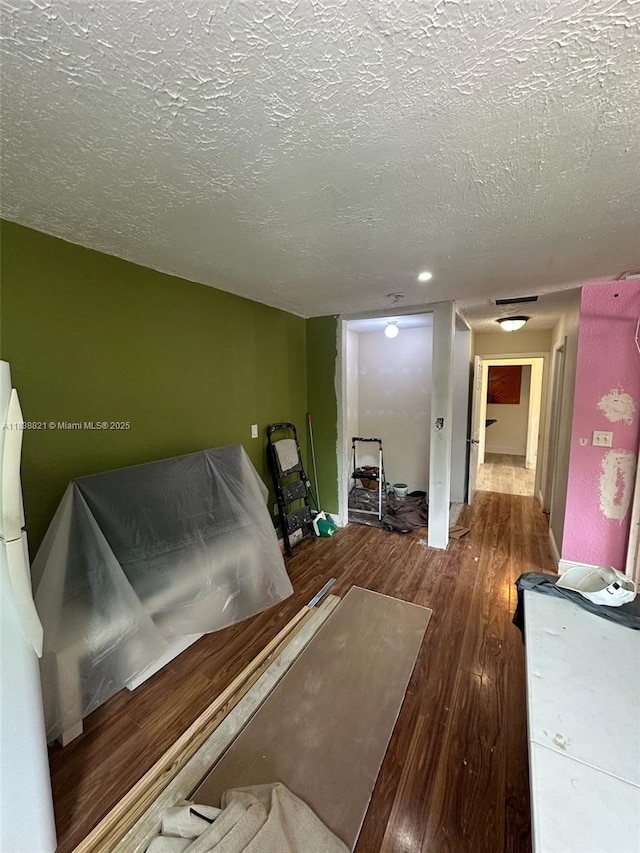1249 S Flamingo Rd, Davie, FL 33325 - miscellaneous room featuring wood finished floors and a textured ceiling