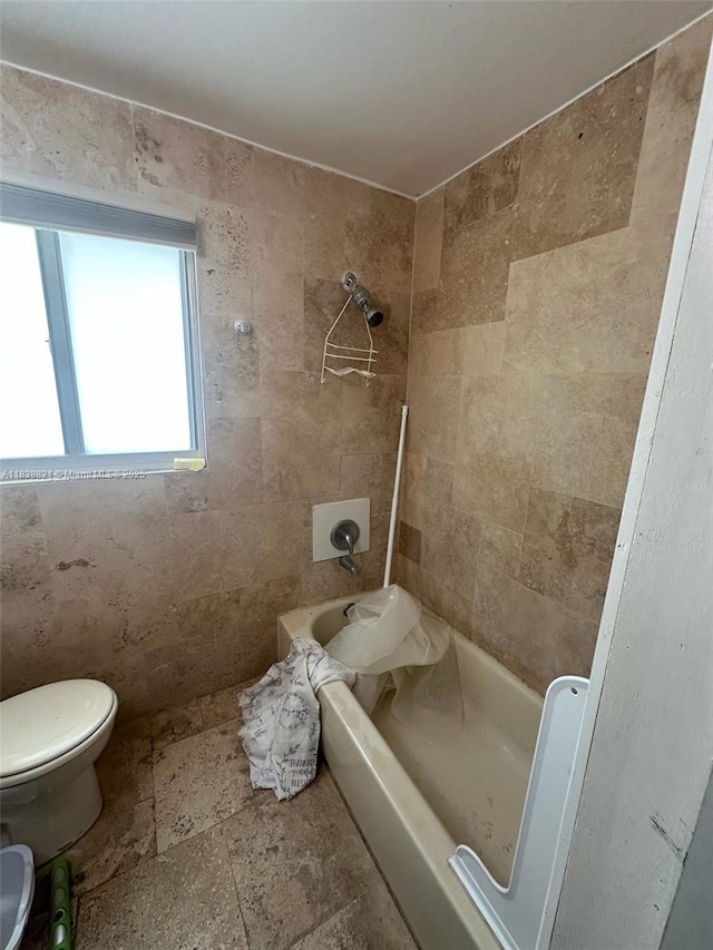 1249 S Flamingo Rd, Davie, FL 33325 - bathroom featuring shower / bath combination and stone tile floors