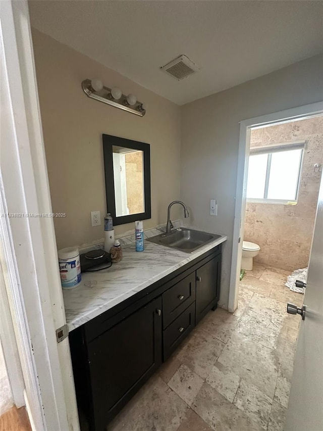 1249 S Flamingo Rd, Davie, FL 33325 - bathroom featuring double vanity and stone finish floors
