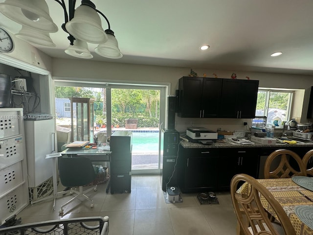 1249 S Flamingo Rd, Davie, FL 33325 - kitchen with light tile patterned floors, recessed lighting, and dark cabinets