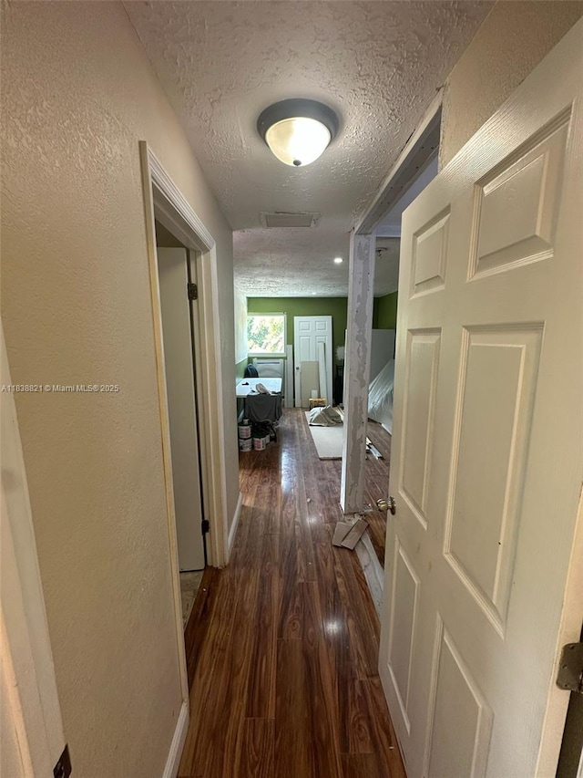 1249 S Flamingo Rd, Davie, FL 33325 - corridor featuring a textured ceiling, wood finished floors, and a textured wall