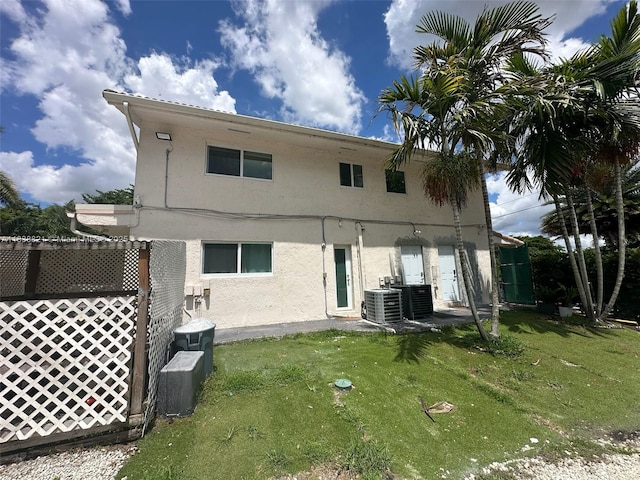 1249 S Flamingo Rd, Davie, FL 33325 - rear view of property featuring stucco siding and a lawn