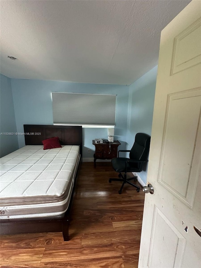 1249 S Flamingo Rd, Davie, FL 33325 - bedroom featuring wood finished floors and a textured ceiling