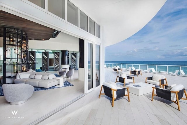 3101 Bayshore Dr Unit 704, Fort Lauderdale, FL 33304 - view of patio / terrace featuring an outdoor living space with a fire pit and a water view