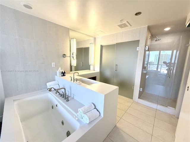 3101 Bayshore Dr Unit 704, Fort Lauderdale, FL 33304 - bathroom featuring tile patterned floors, a tub with jets, vanity, and an enclosed shower