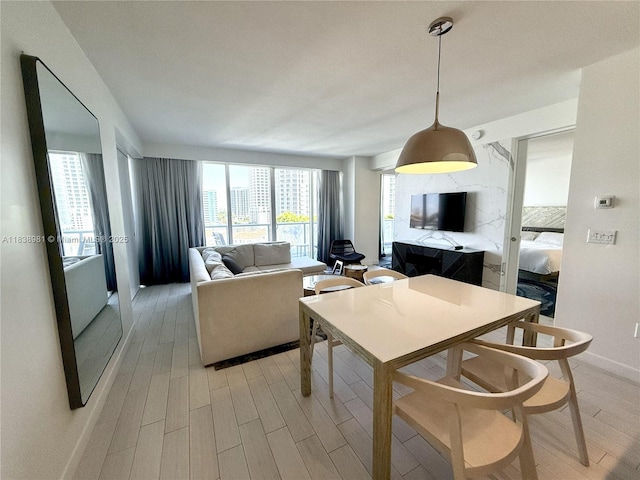 3101 Bayshore Dr Unit 704, Fort Lauderdale, FL 33304 - dining area with light wood-type flooring and baseboards