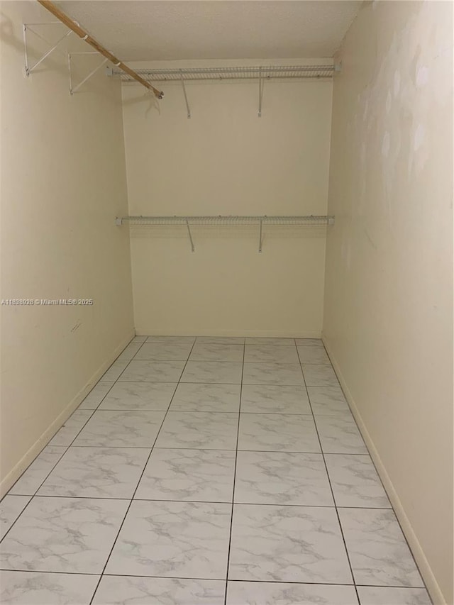 2405 Antigua Cir Unit H1, Coconut Creek, FL 33066 - spacious closet with light marble finish flooring