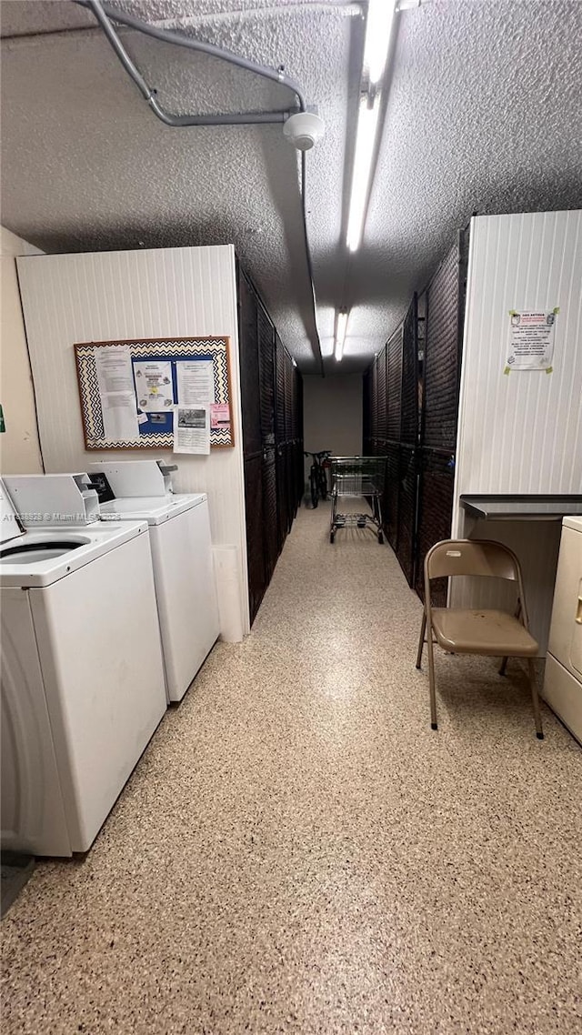 2405 Antigua Cir Unit H1, Coconut Creek, FL 33066 - washroom featuring washer and dryer and a textured ceiling