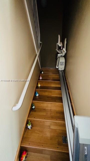 2385 W 69th St Unit 2385-B, Hialeah, FL 33016 - staircase featuring wood finished floors