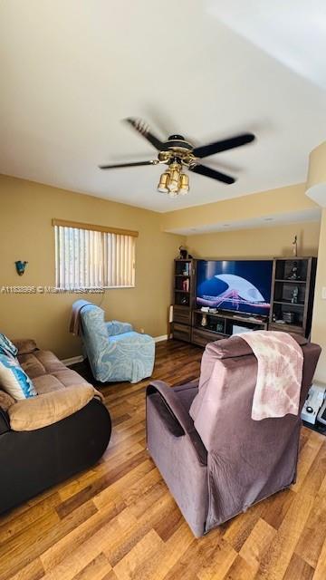 2385 W 69th St Unit 2385-B, Hialeah, FL 33016 - living area featuring wood finished floors and ceiling fan