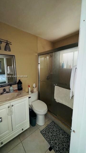 2385 W 69th St Unit 2385-B, Hialeah, FL 33016 - full bathroom with vanity, a shower stall, and tile patterned flooring