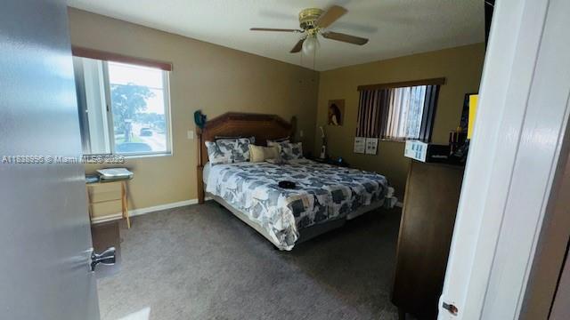 2385 W 69th St Unit 2385-B, Hialeah, FL 33016 - bedroom with carpet floors and a ceiling fan