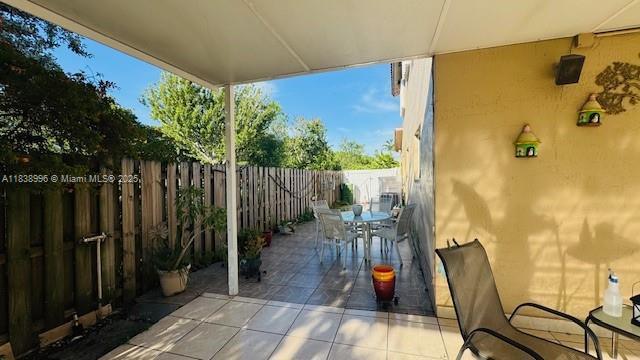 2385 W 69th St Unit 2385-B, Hialeah, FL 33016 - fenced backyard with a patio and outdoor dining space