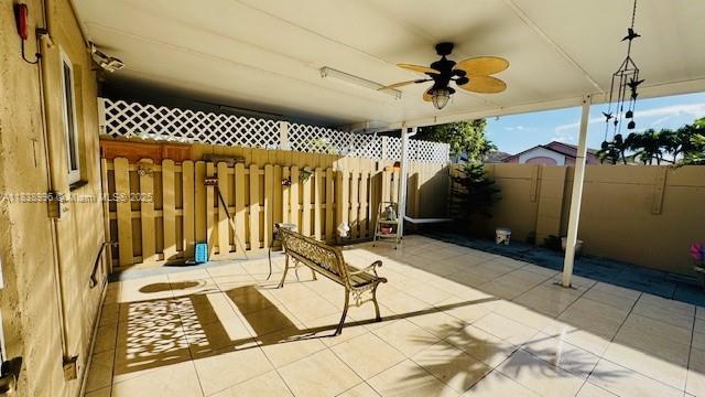 2385 W 69th St Unit 2385-B, Hialeah, FL 33016 - fenced backyard with a patio area and a ceiling fan
