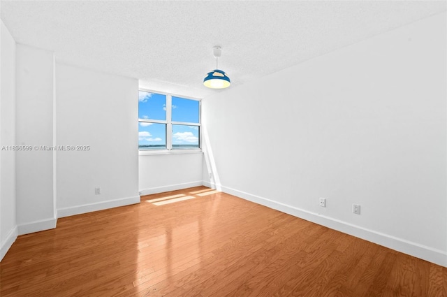 770 Claughton Island Dr Unit 1915, Miami, FL 33131 - empty room featuring light wood finished floors and a textured ceiling