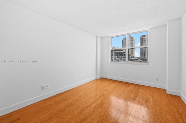 770 Claughton Island Dr Unit 1915, Miami, FL 33131 - unfurnished room featuring baseboards and light wood-style flooring