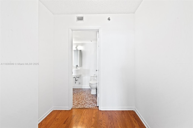770 Claughton Island Dr Unit 1915, Miami, FL 33131 - hall with wood finished floors and a textured ceiling
