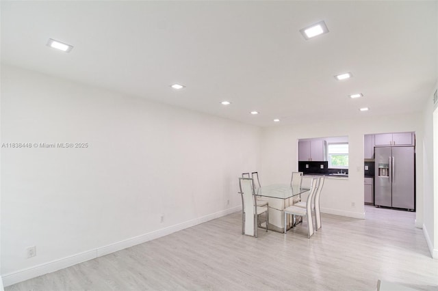 5387 SW 40th Ave Unit 202, Dania Beach, FL 33314 - unfurnished dining area with light wood-style floors and recessed lighting