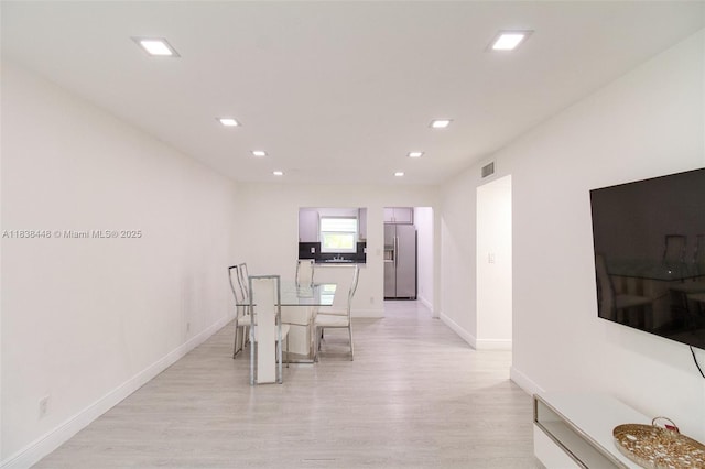 5387 SW 40th Ave Unit 202, Dania Beach, FL 33314 - dining space featuring light wood-style flooring and recessed lighting
