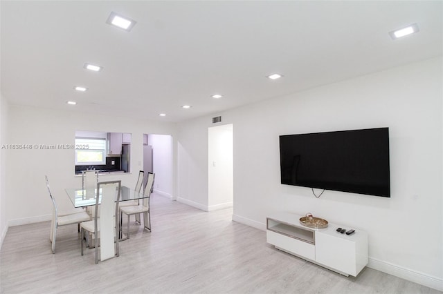 5387 SW 40th Ave Unit 202, Dania Beach, FL 33314 - dining area featuring light wood-type flooring and recessed lighting