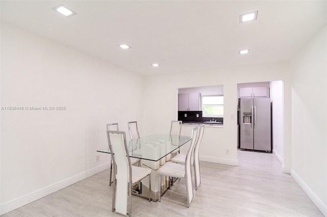 5387 SW 40th Ave Unit 202, Dania Beach, FL 33314 - dining space with light wood-type flooring and recessed lighting